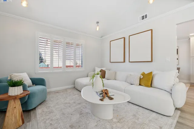 a living room with furniture and white walls