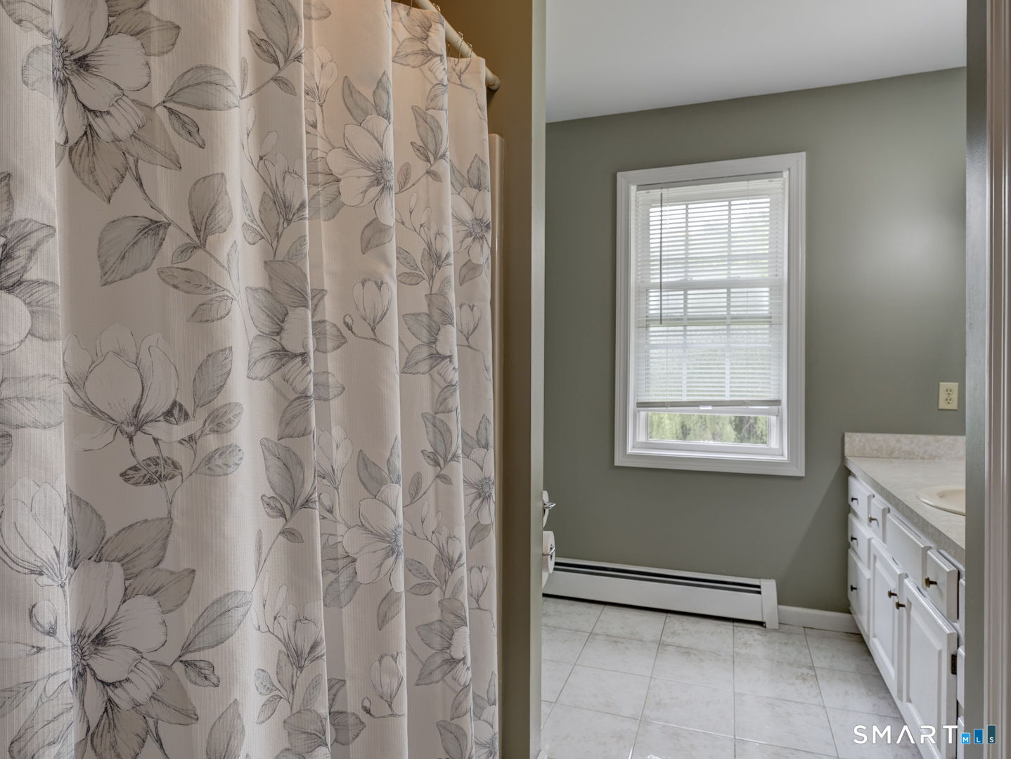 100 Mt Tobe Road Plymouth, CT 06782 - Photo 13 of 35 1st floor bathroom, tile floor , tub with shower .