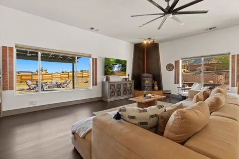 a large kitchen with a table and chairs