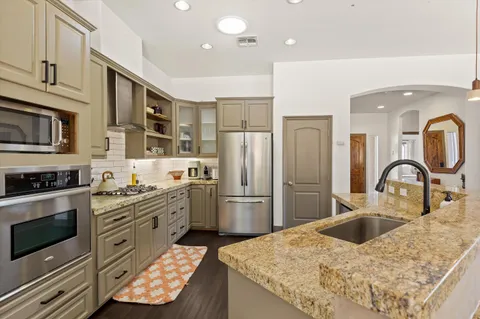 a view of living room with granite countertop furniture and fireplace