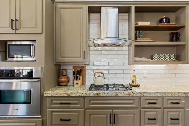 a bedroom with bed and window