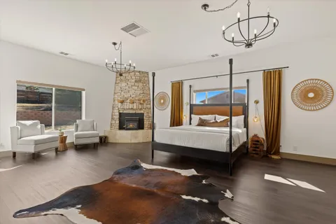 a bedroom with bed and wooden floor