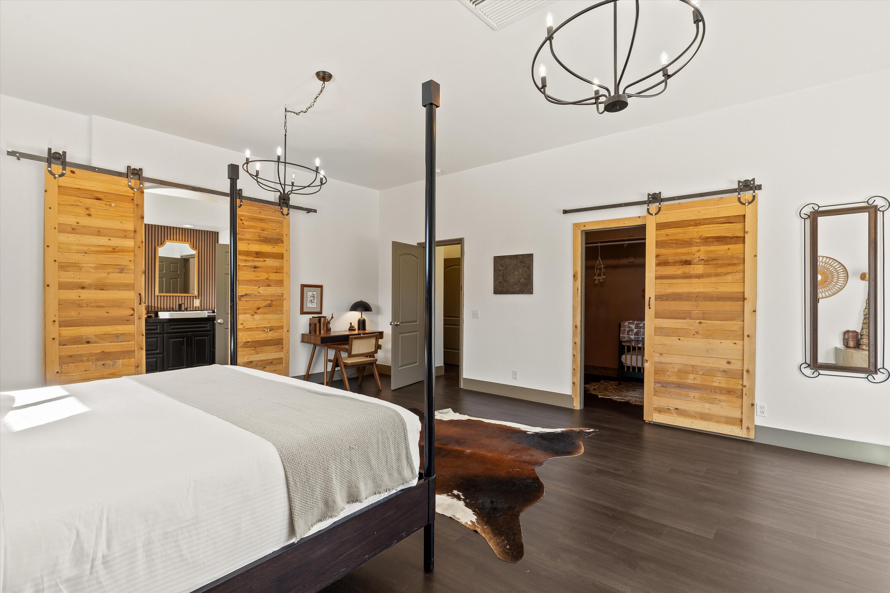 60377 Pueblo Trail Joshua Tree, CA 92252 - Photo 22 of 57 a bedroom with bed and wooden floor