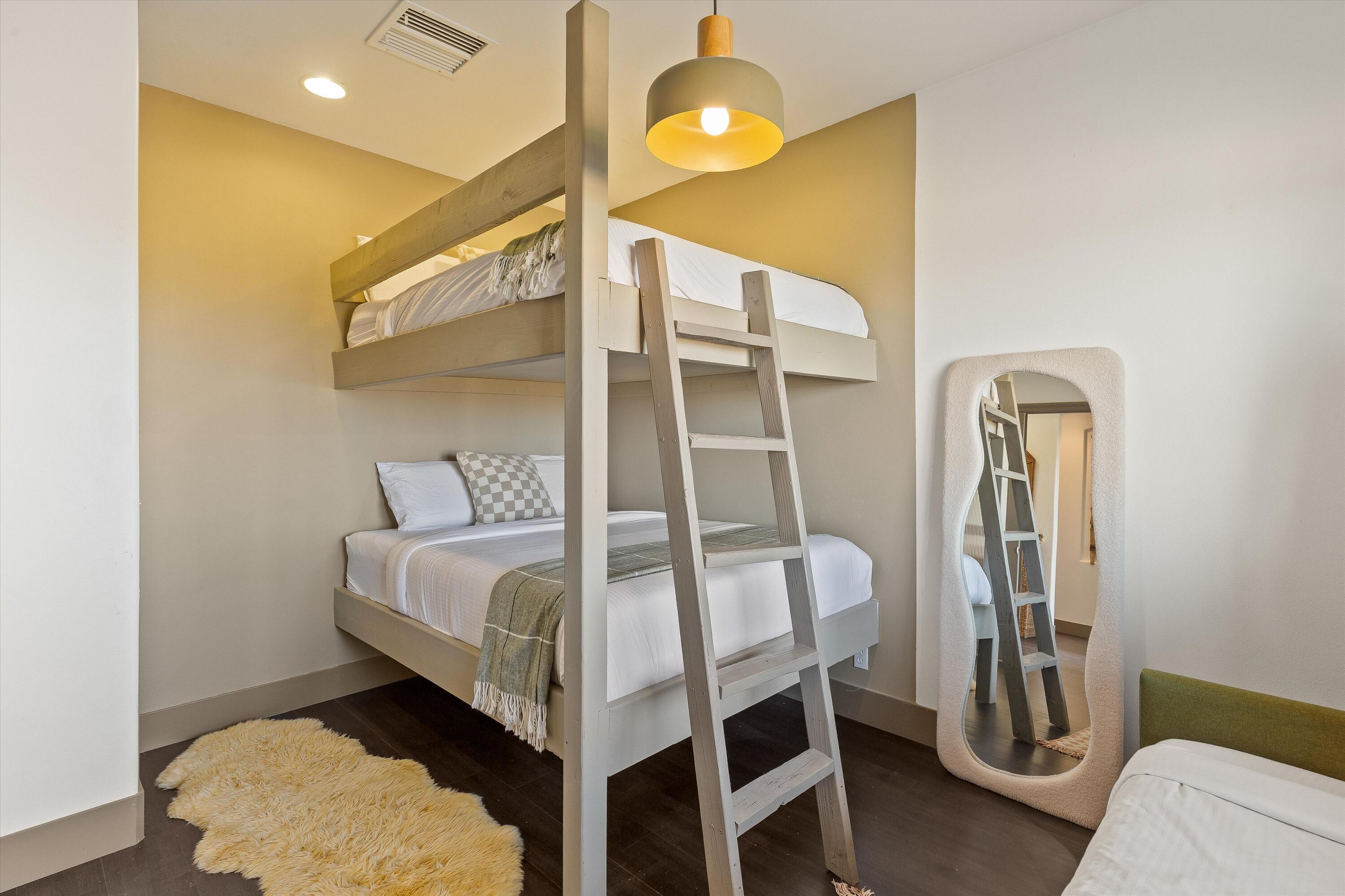 60377 Pueblo Trail Joshua Tree, CA 92252 - Photo 30 of 57 a bedroom with a bed and a mirror