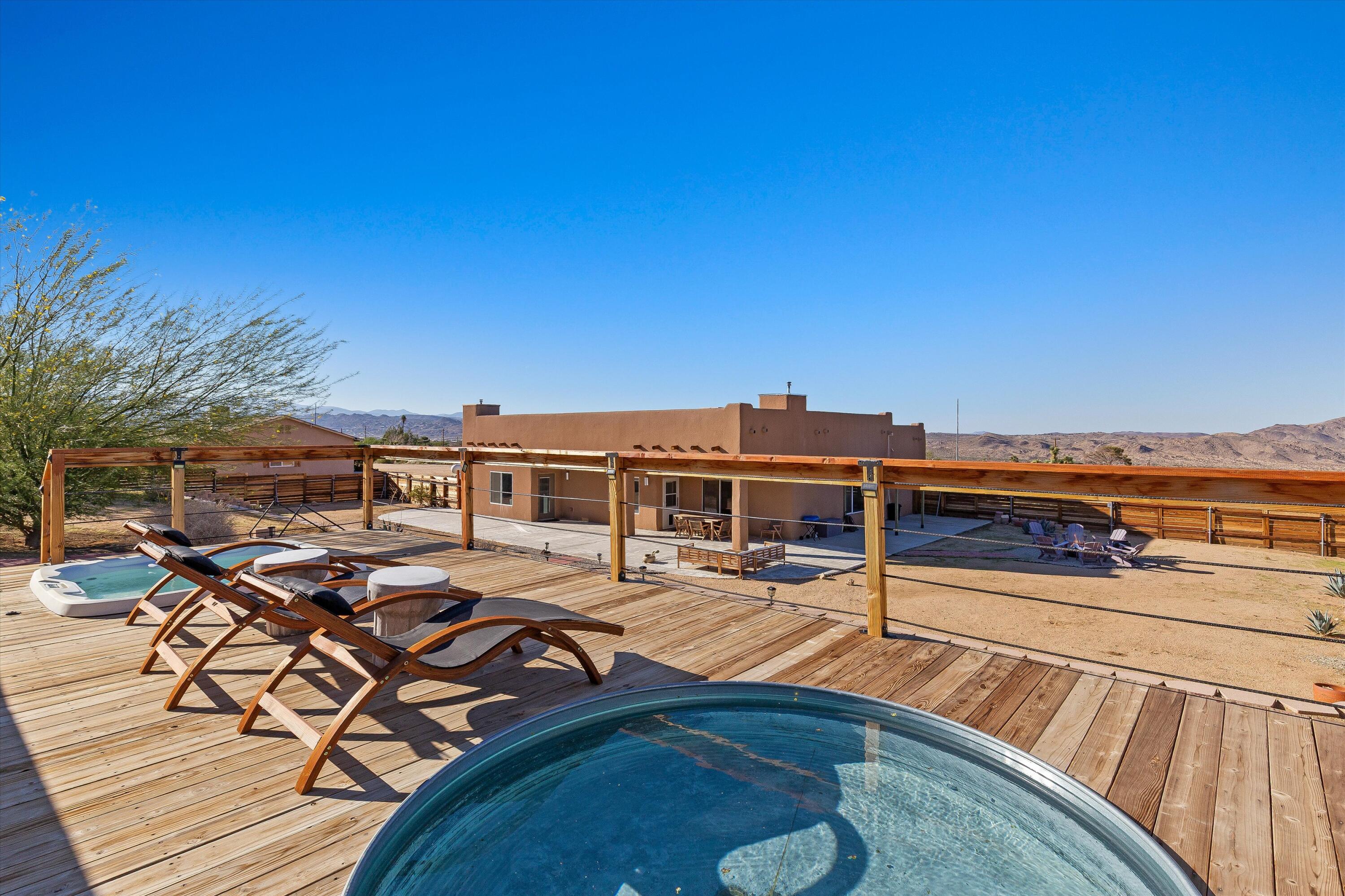60377 Pueblo Trail Joshua Tree, CA 92252 - Photo 3 of 57 a view of a roof deck with chair and wooden floor