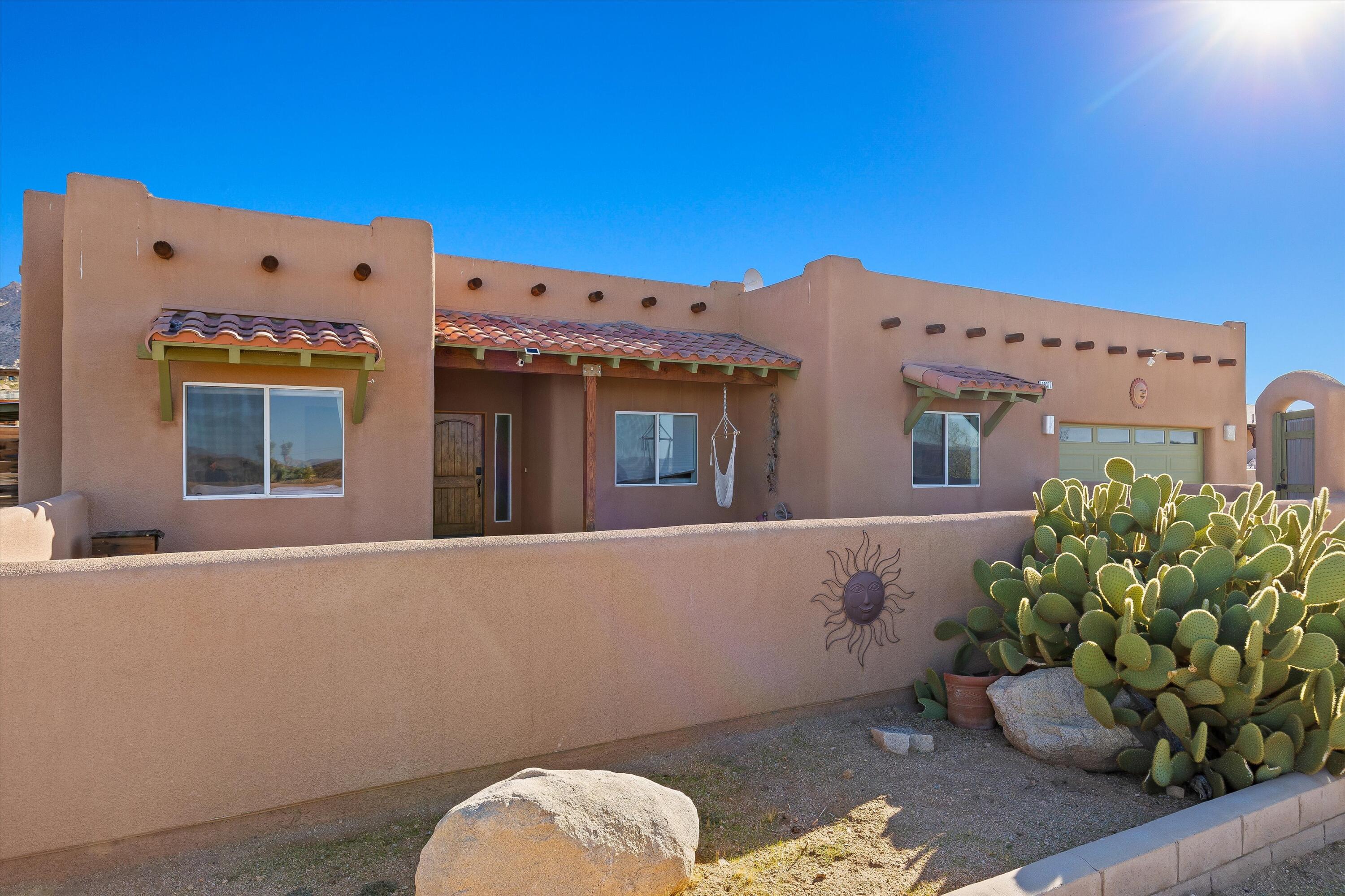 60377 Pueblo Trail Joshua Tree, CA 92252 - Photo 39 of 57 a view of a house with a potted plant