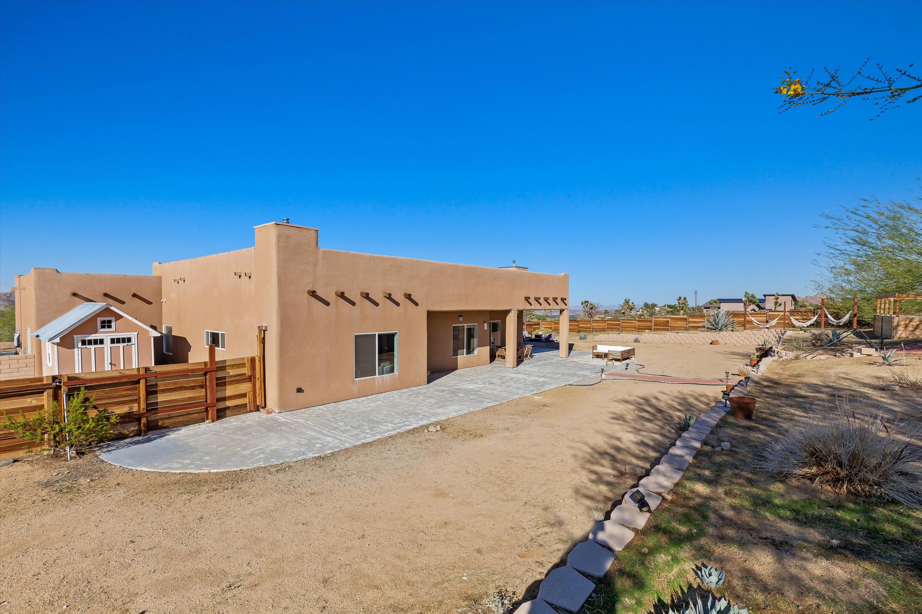 60377 Pueblo Trail Joshua Tree, CA 92252 - Photo 42 of 57 a view of a house with a outdoor space