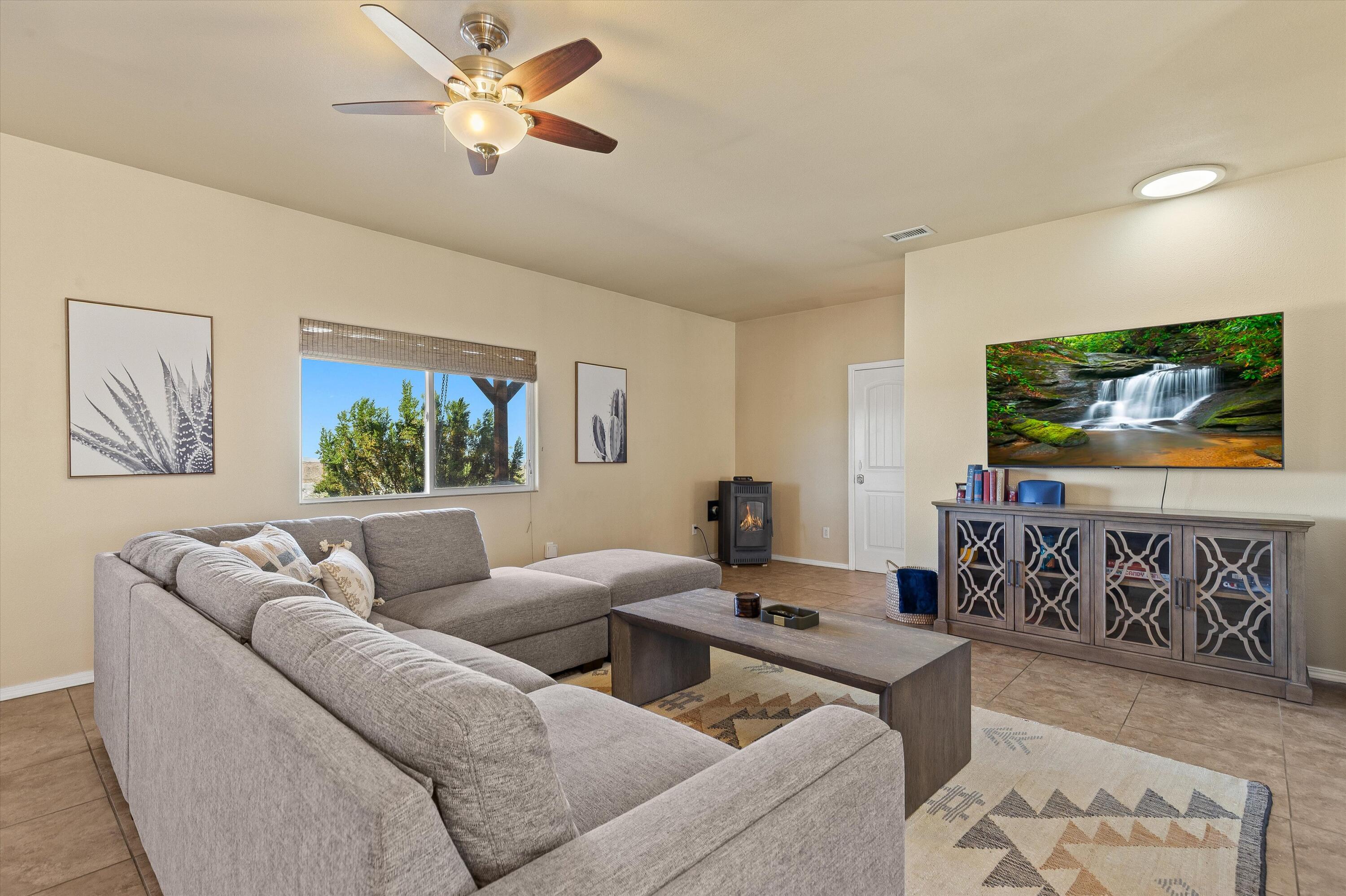 60377 Pueblo Trail Joshua Tree, CA 92252 - Photo 46 of 57 a living room with furniture and a flat screen tv