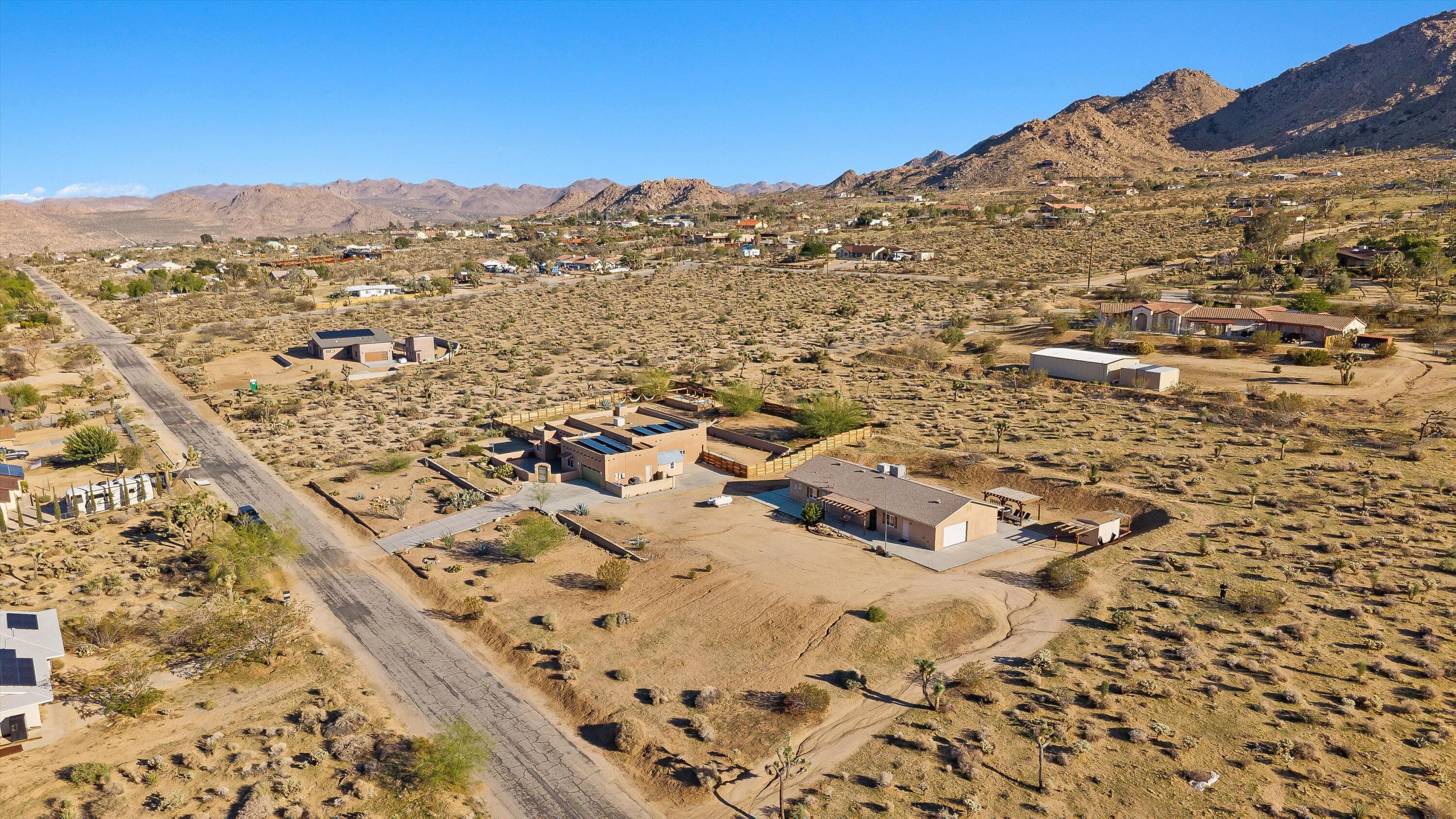 60377 Pueblo Trail Joshua Tree, CA 92252 - Photo 57 of 57 an aerial view of residential houses with outdoor space
