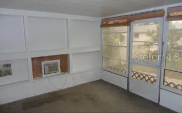 a view of an empty room and window