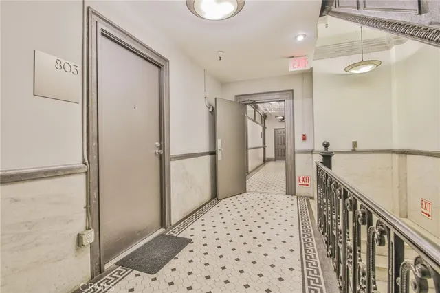 a view of a chair and tables in patio