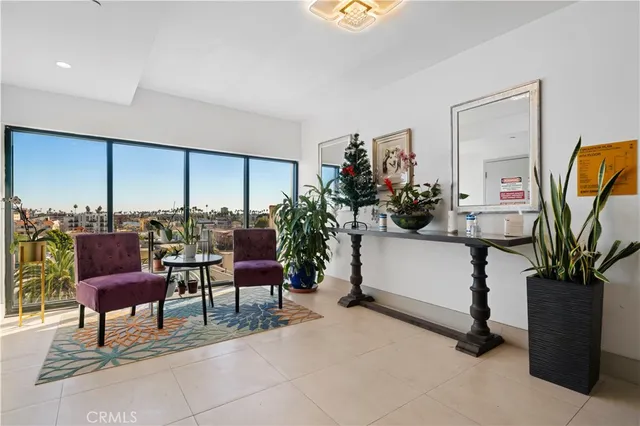 a view of a livingroom with furniture and a potted plant