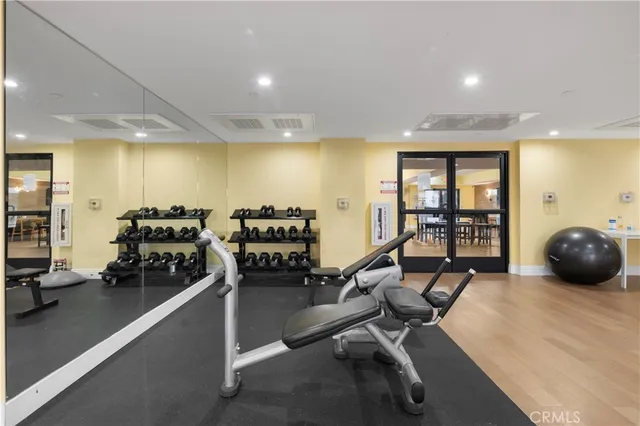 a room with lots of chairs and couches