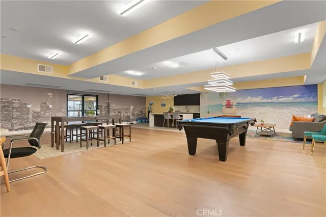 a room with lots of furniture and a large window