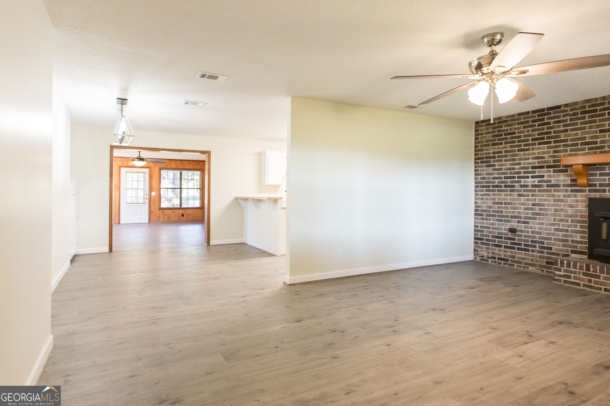 6731 Youmans Chapel Road Blackshear, GA 31516 - Photo 11 of 33 an empty room with fan and windows
