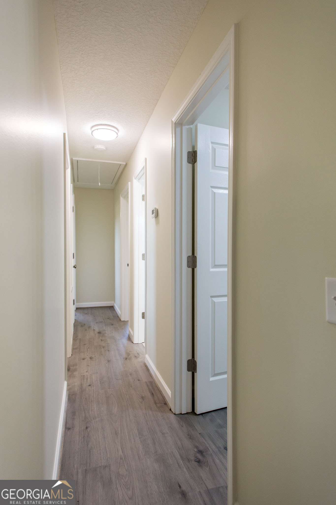 6731 Youmans Chapel Road Blackshear, GA 31516 - Photo 23 of 33 a view of hallway with wooden floor