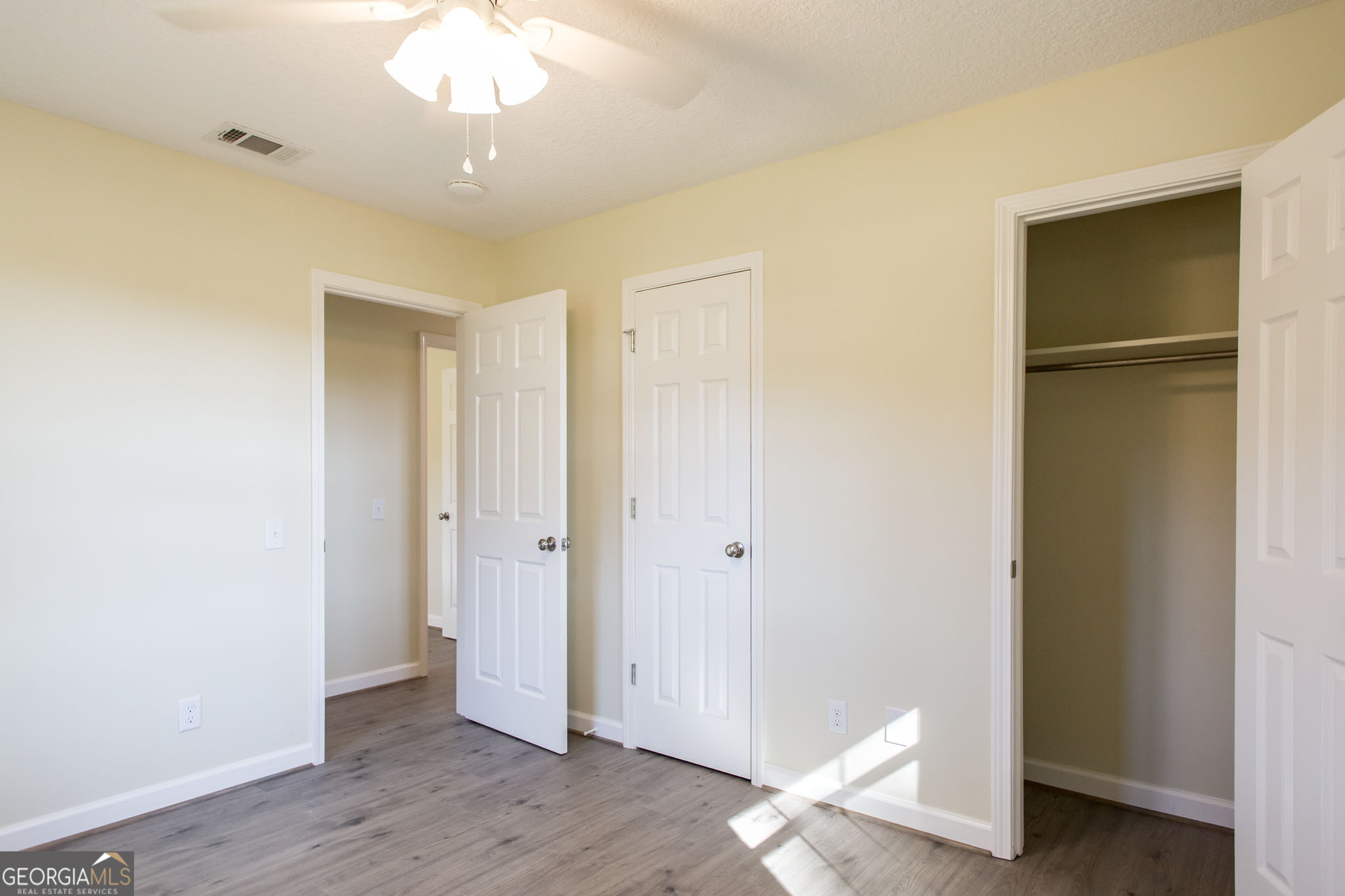 6731 Youmans Chapel Road Blackshear, GA 31516 - Photo 30 of 33 a view of empty room with wooden floor