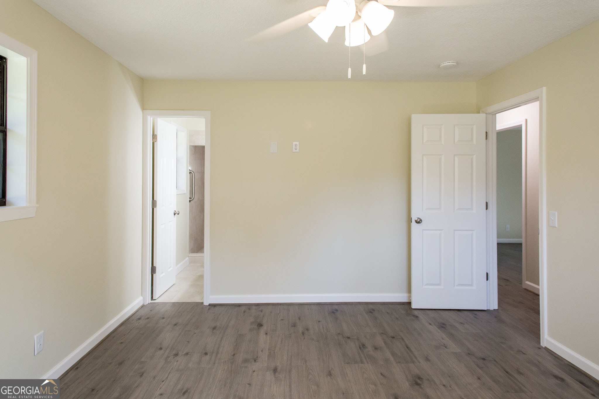 6731 Youmans Chapel Road Blackshear, GA 31516 - Photo 32 of 33 a view of an empty room with wooden floor