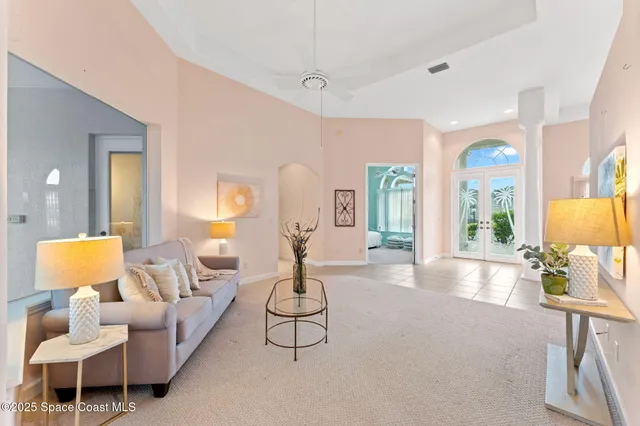 a living room with furniture and a lamp
