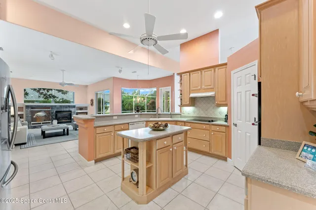 a kitchen with stainless steel appliances granite countertop a sink and cabinets