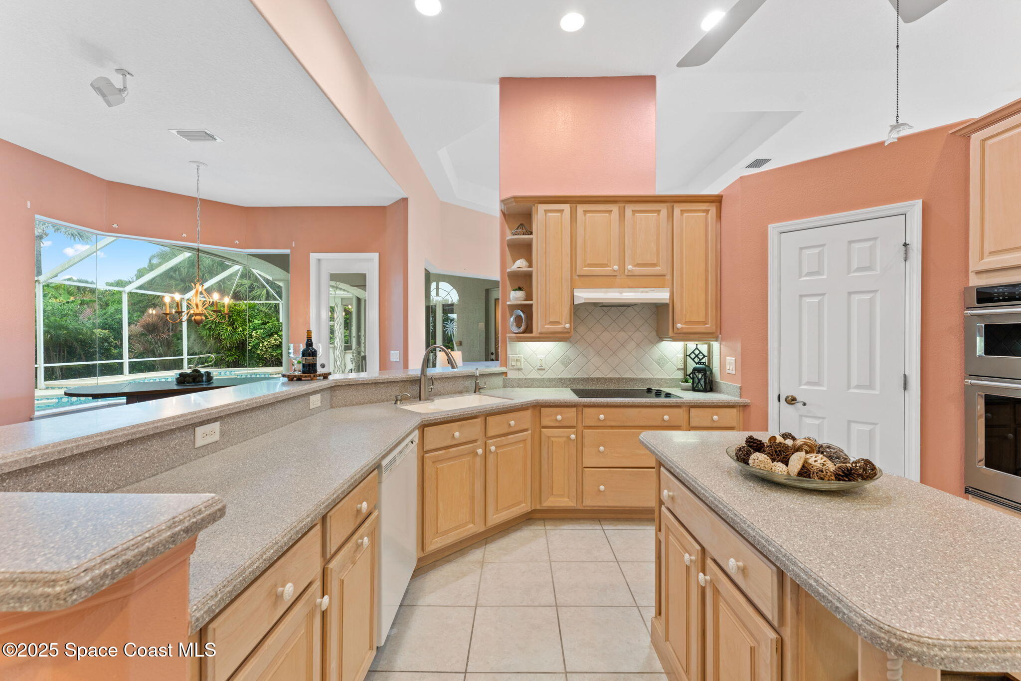 235 Loggerhead Drive Melbourne Beach, FL 32951 - Photo 17 of 50 a kitchen with a sink stove and cabinets