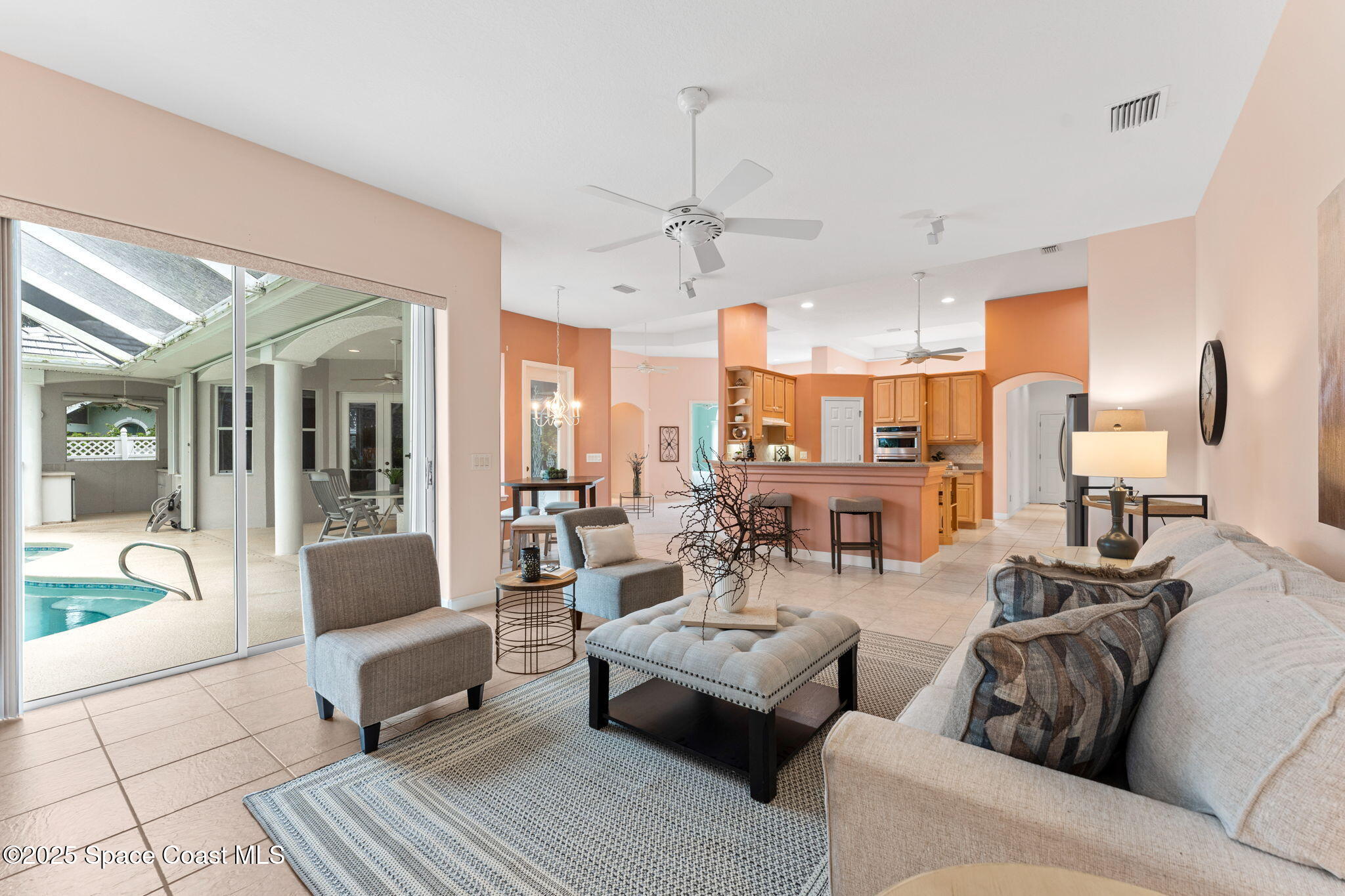 235 Loggerhead Drive Melbourne Beach, FL 32951 - Photo 21 of 50 a living room with furniture and a chandelier
