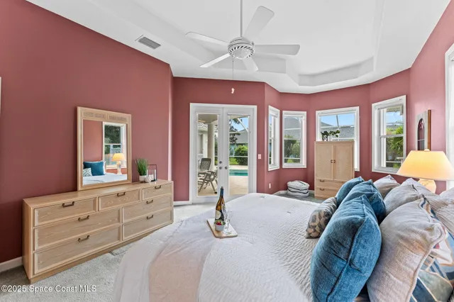 a bedroom with a large bed and a window