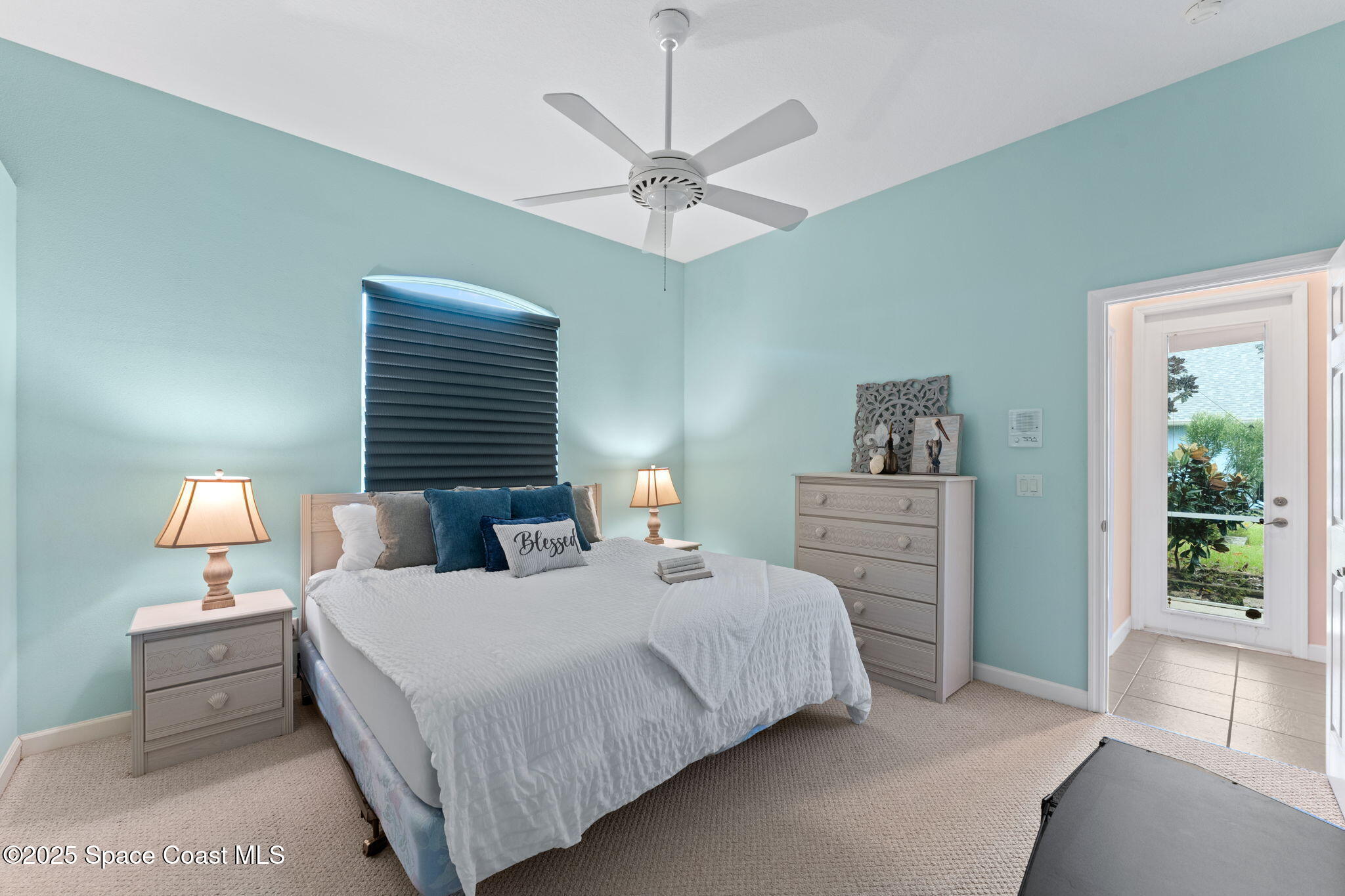 235 Loggerhead Drive Melbourne Beach, FL 32951 - Photo 28 of 50 a bedroom with bed and window
