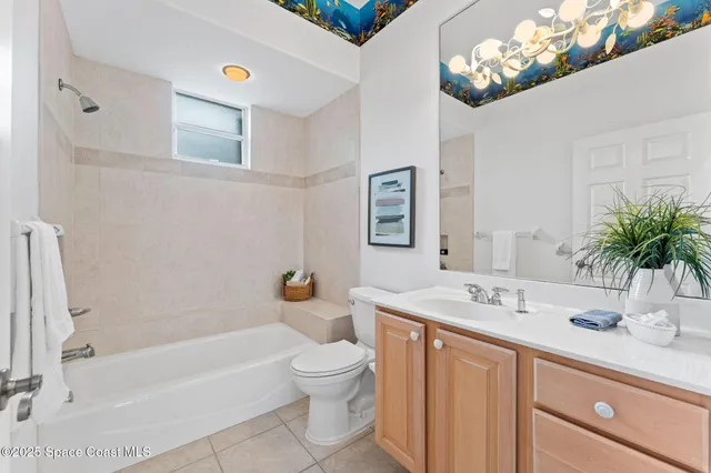 a bathroom with a sink a toilet and bathtub