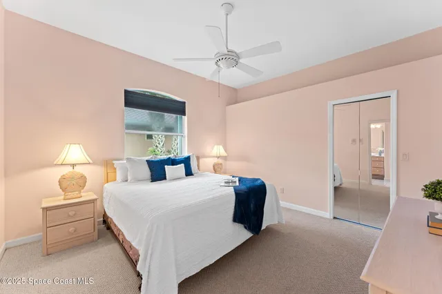 a bedroom with a bed and a cabinets