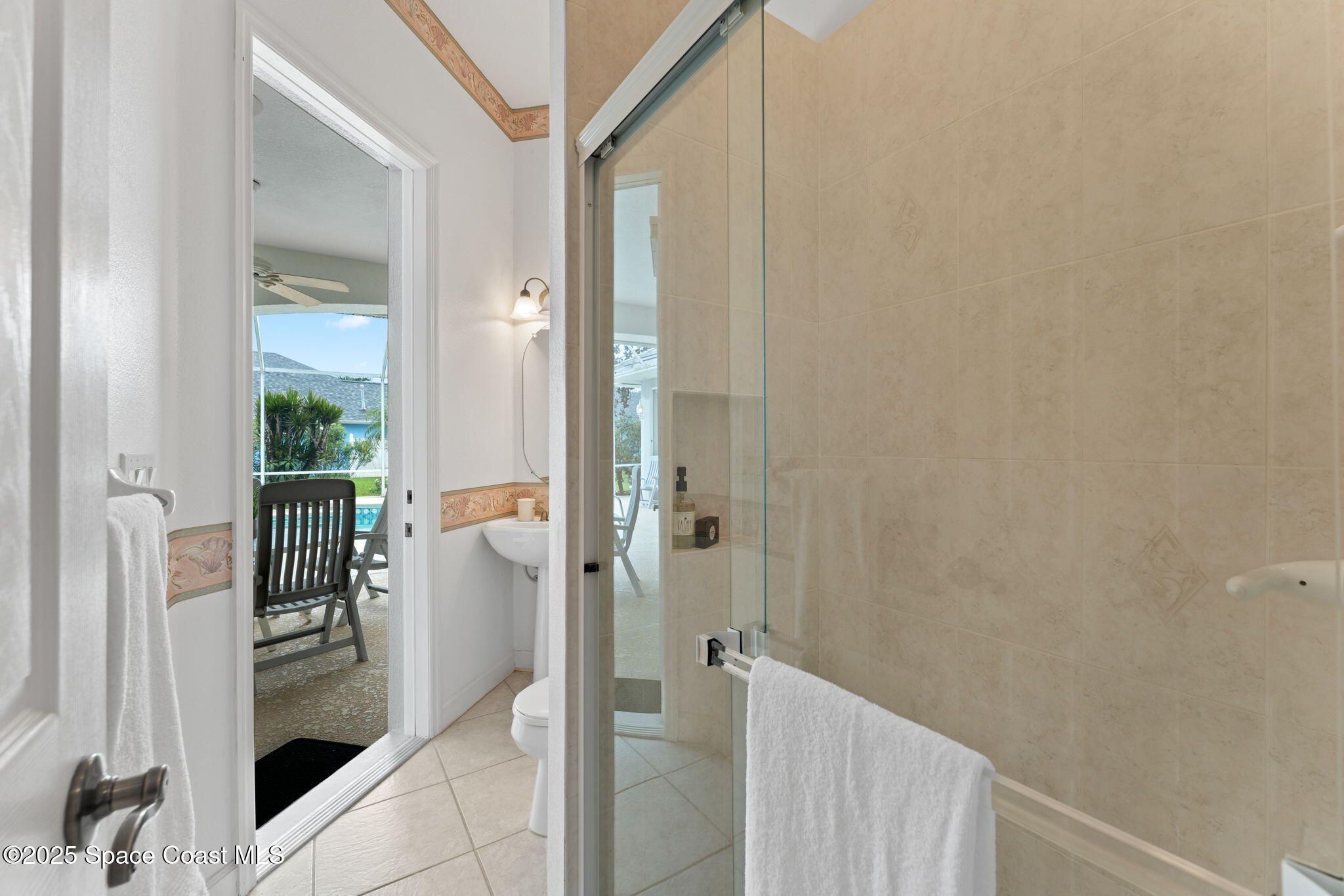 235 Loggerhead Drive Melbourne Beach, FL 32951 - Photo 33 of 50 a bathroom with a shower