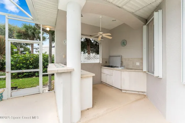 a kitchen with a sink and a large window