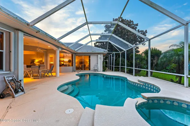 a view of a swimming pool with a patio