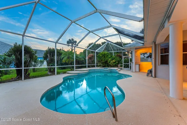 a view of a backyard with swimming pool