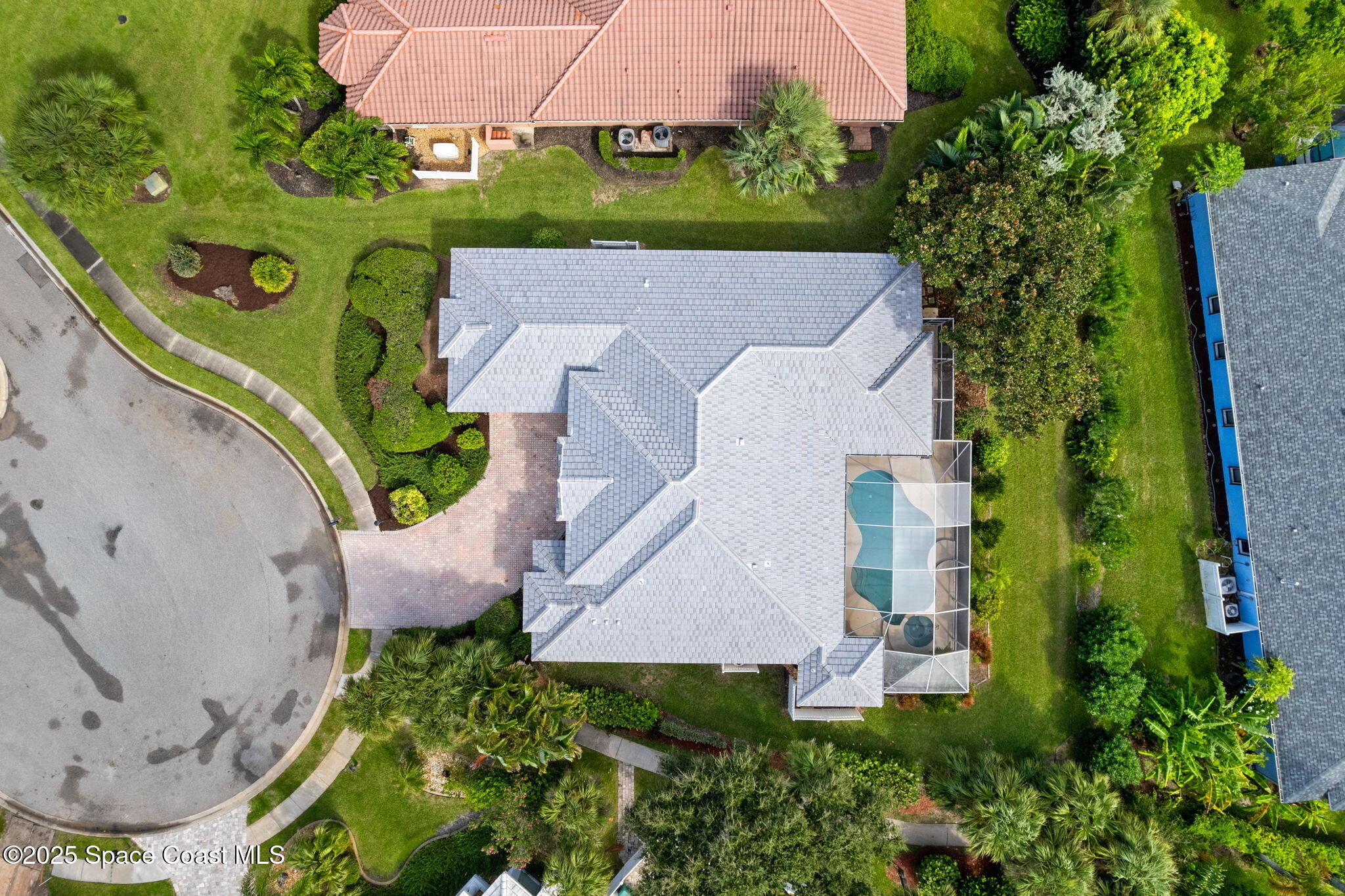 235 Loggerhead Drive Melbourne Beach, FL 32951 - Photo 5 of 50 an aerial view of a house with garden space and street view