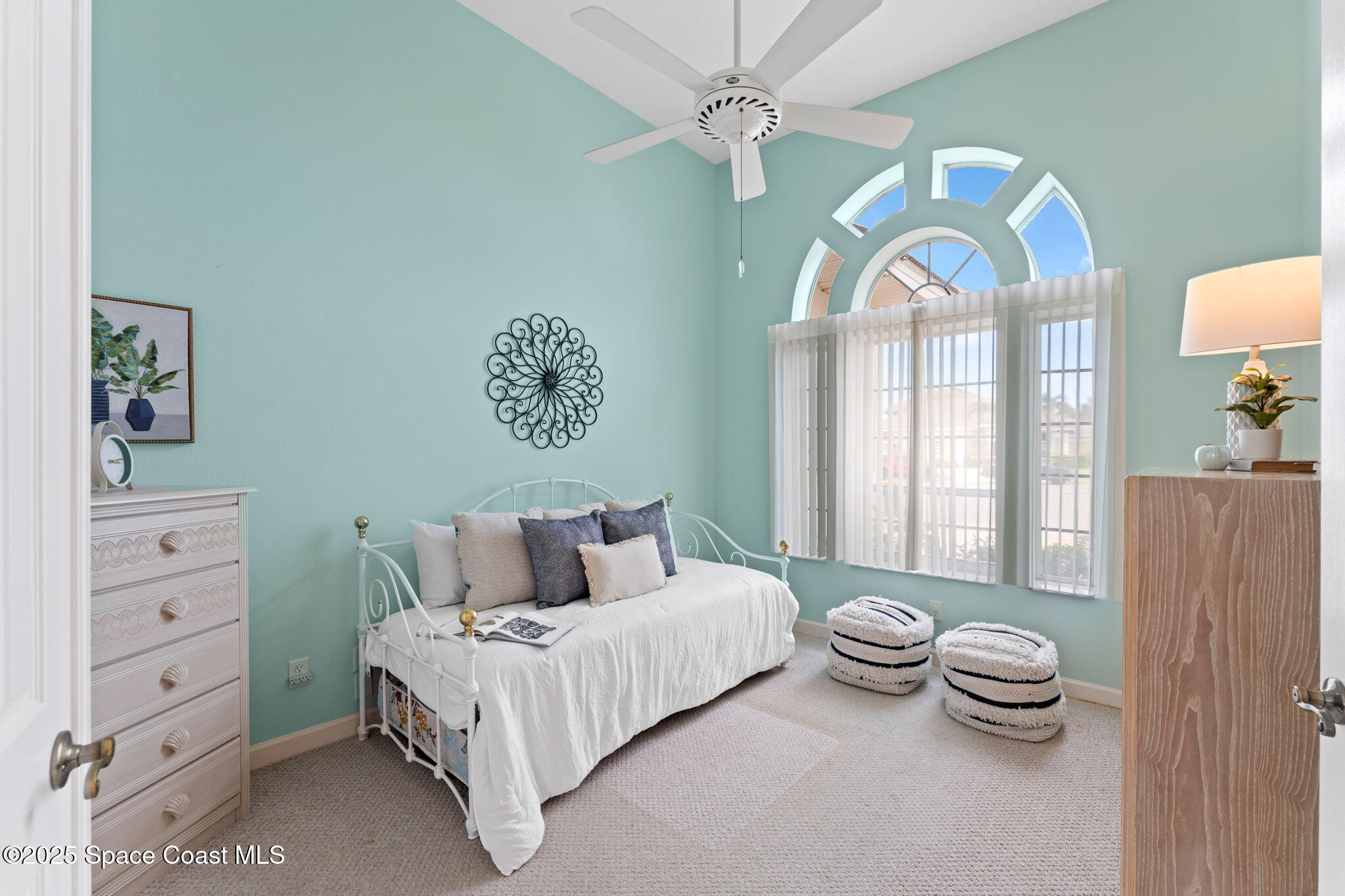 235 Loggerhead Drive Melbourne Beach, FL 32951 - Photo 9 of 50 a bedroom with a bed and a painting on the wall