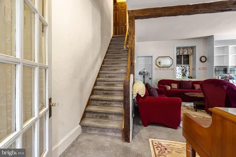 a living room with furniture or couch and a window