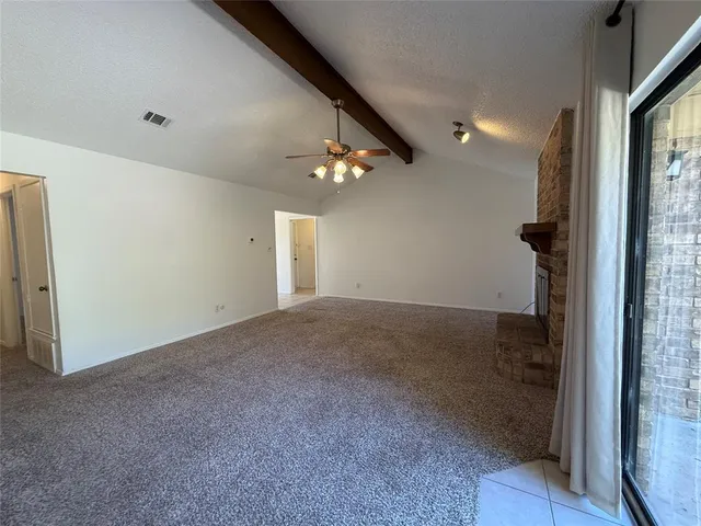 a view of a hallway to a bedroom