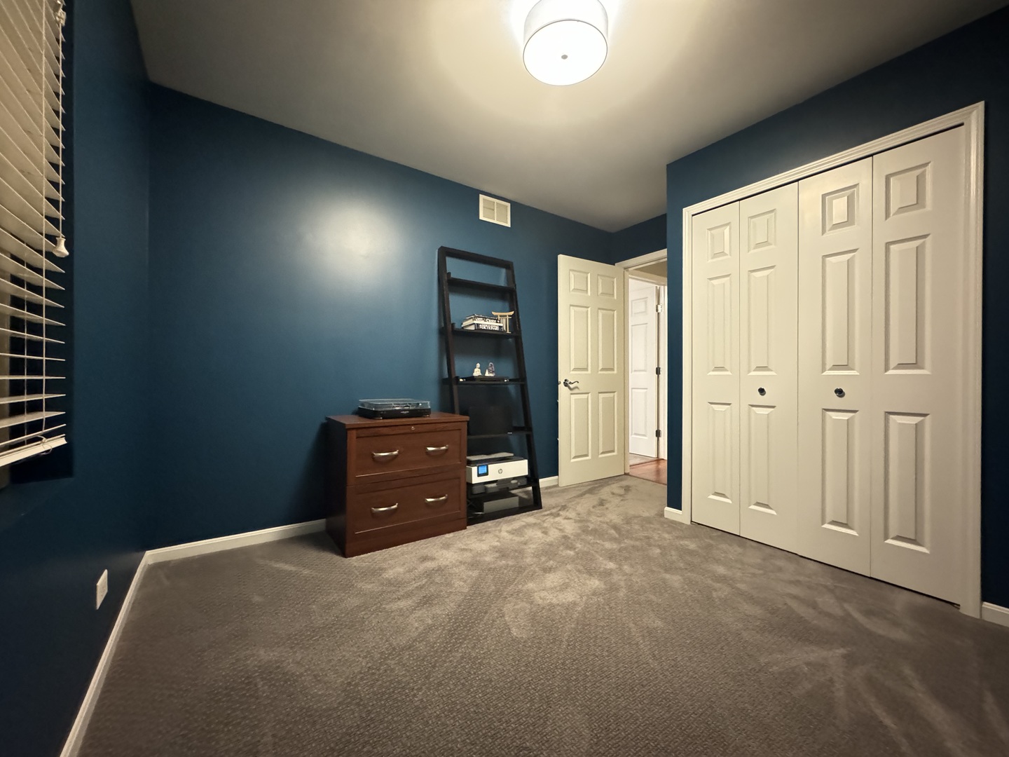 4535 West Irving Park Road Chicago, IL 60641 - Photo 9 of 15 an empty room with closet and windows
