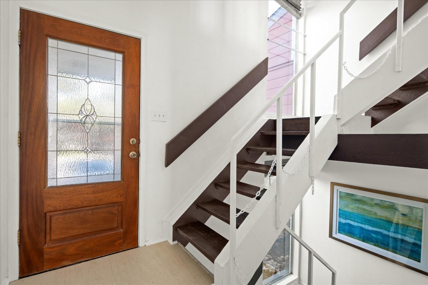 559 Demarett Drive Point Venture, TX 78645 - Photo 14 of 23 Foyer entrance featuring healthy amount of natural light and stairs