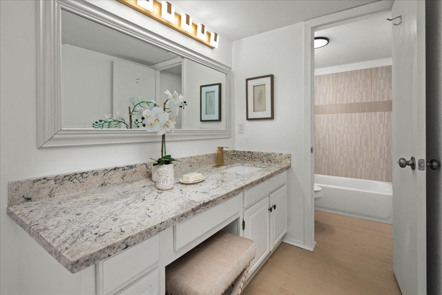 559 Demarett Drive Point Venture, TX 78645 - Photo 9 of 23 Bathroom with vanity and shower / washtub combination