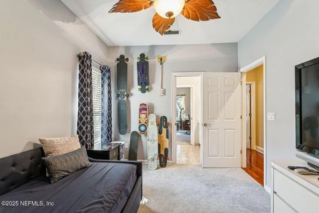 a bathroom with a shower curtain and a bathtub