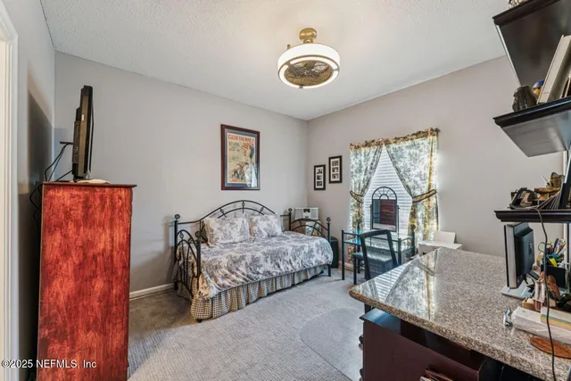a kitchen with stainless steel appliances granite countertop a refrigerator and a wooden cabinets