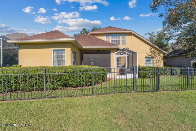 a view of a wrought iron fences in front of house