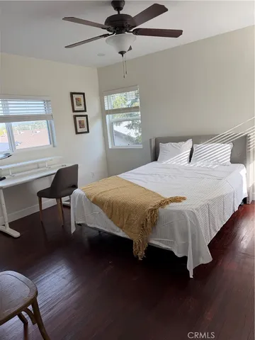 a bedroom with bed and a window