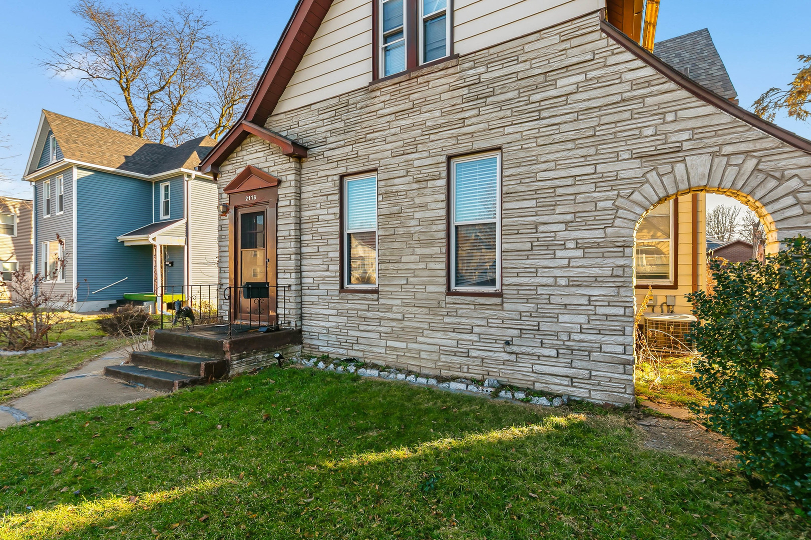 2115 West 4th Street Davenport, IA 52802 - Photo 1 of 24 a front view of a house with garden