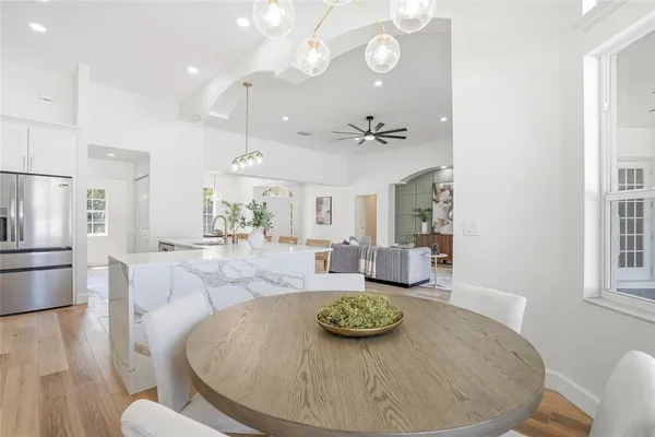 a bedroom with a bed and a potted plant