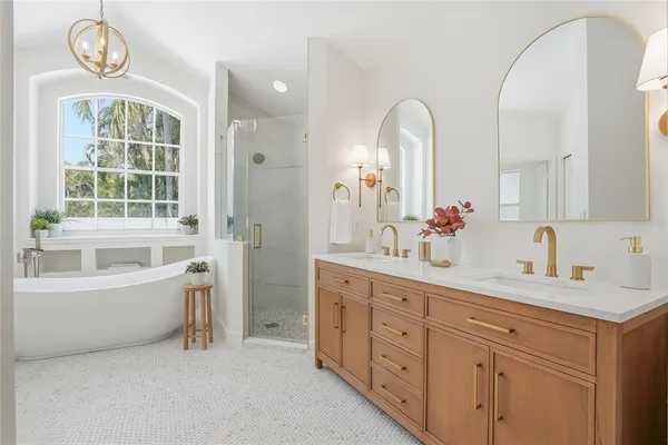 a bathroom with a bathtub and shower