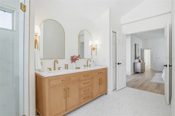 a white bath tub sitting in a bathroom next to a window