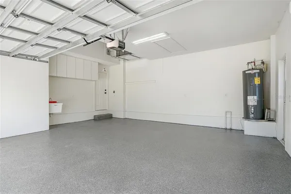 a view of a house with a yard and fence